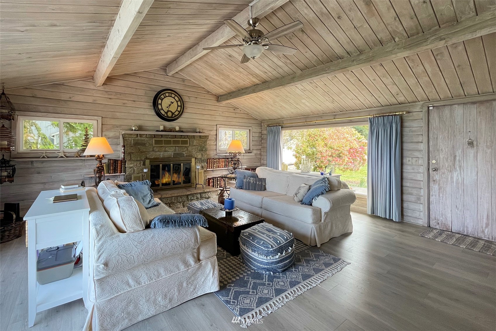 622 West Anderson Road Sequim, WA 98382 - Photo 10 of 40 a living room with furniture a fireplace and a large window