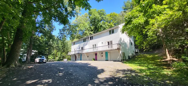 a view of a house with a tree