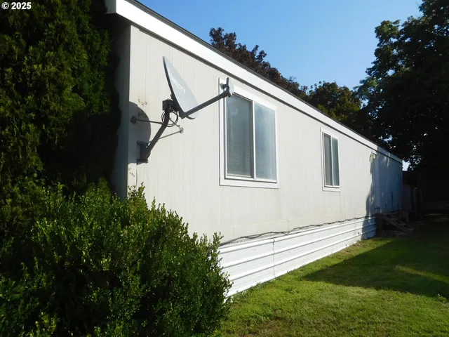 a backyard of a house with lots of green space