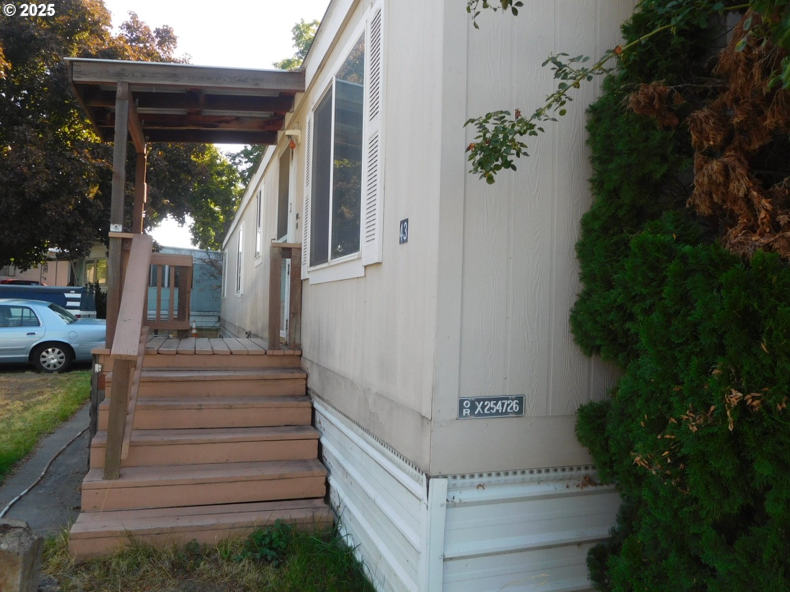 1437 Southwest 37th Street, Unit 43 Pendleton, OR 97801 - Photo 4 of 21 a view of a house with large windows and plants