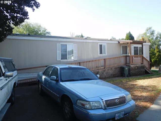 a view of a car parked in front of a house