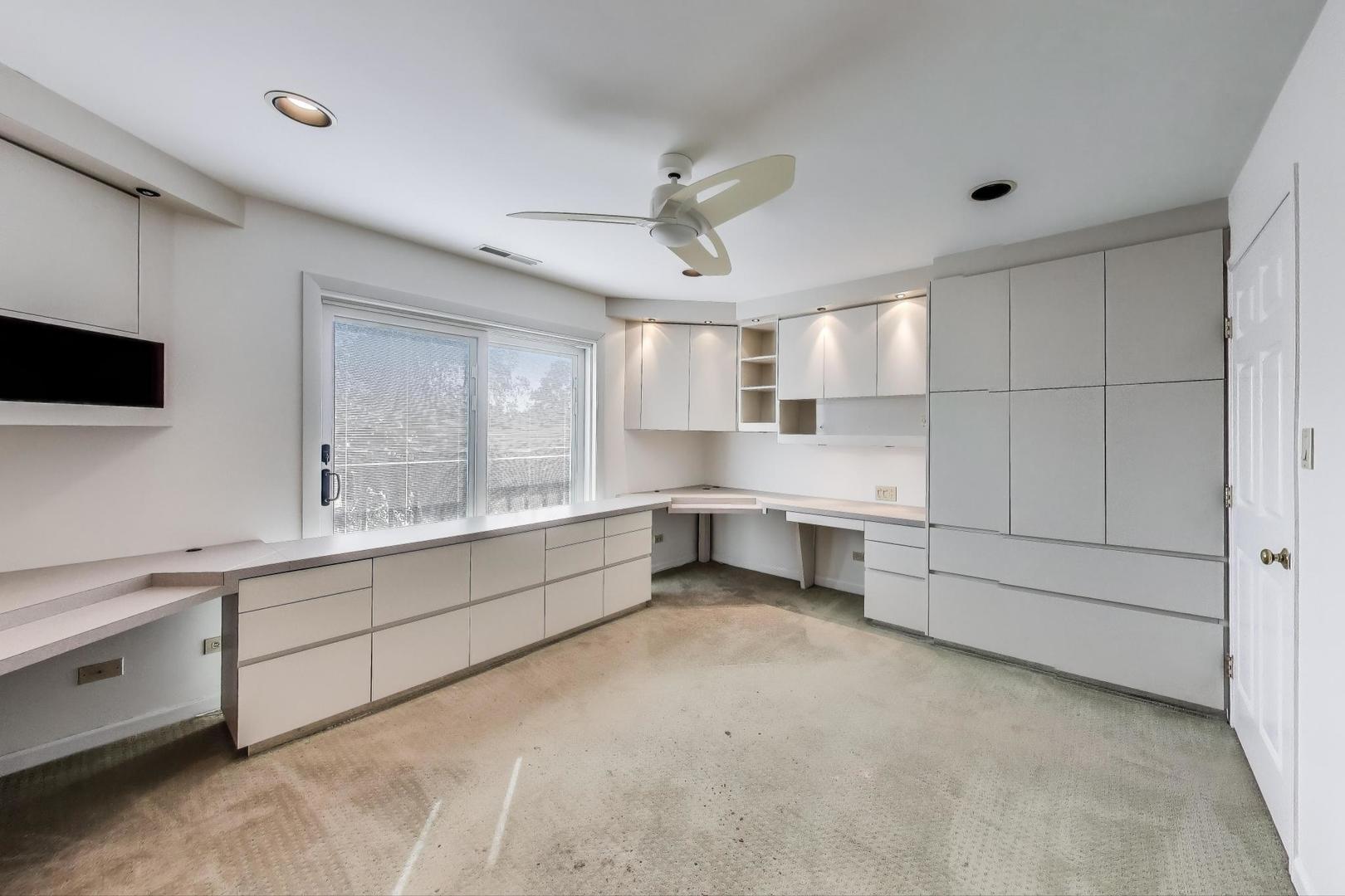 2720 Central Street, Unit 4C Evanston, IL 60201 - Photo 16 of 25 a large white kitchen with a stove a sink and a refrigerator