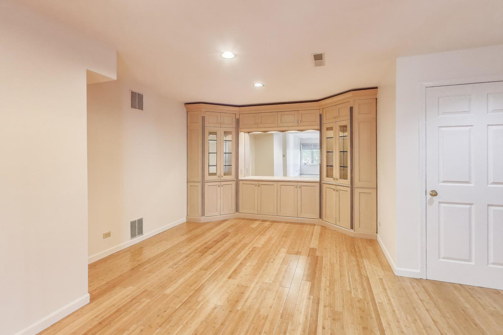 2720 Central Street, Unit 4C Evanston, IL 60201 - Photo 7 of 25 a view of an empty room with wooden floor