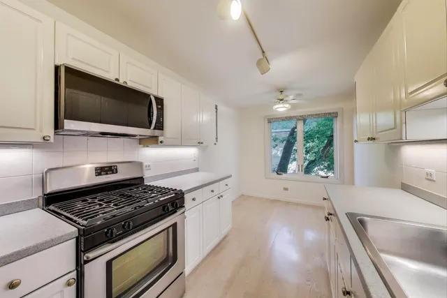 a kitchen with a stove and a microwave
