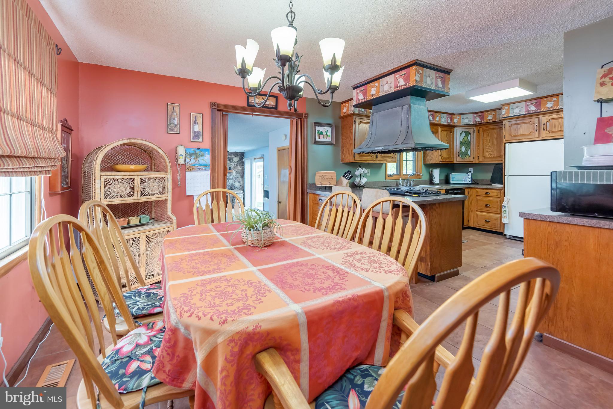 23 Randolph Road West Deptford, NJ 08096 - Photo 4 of 18 a view of a dining room with furniture a chandelier and wooden floor
