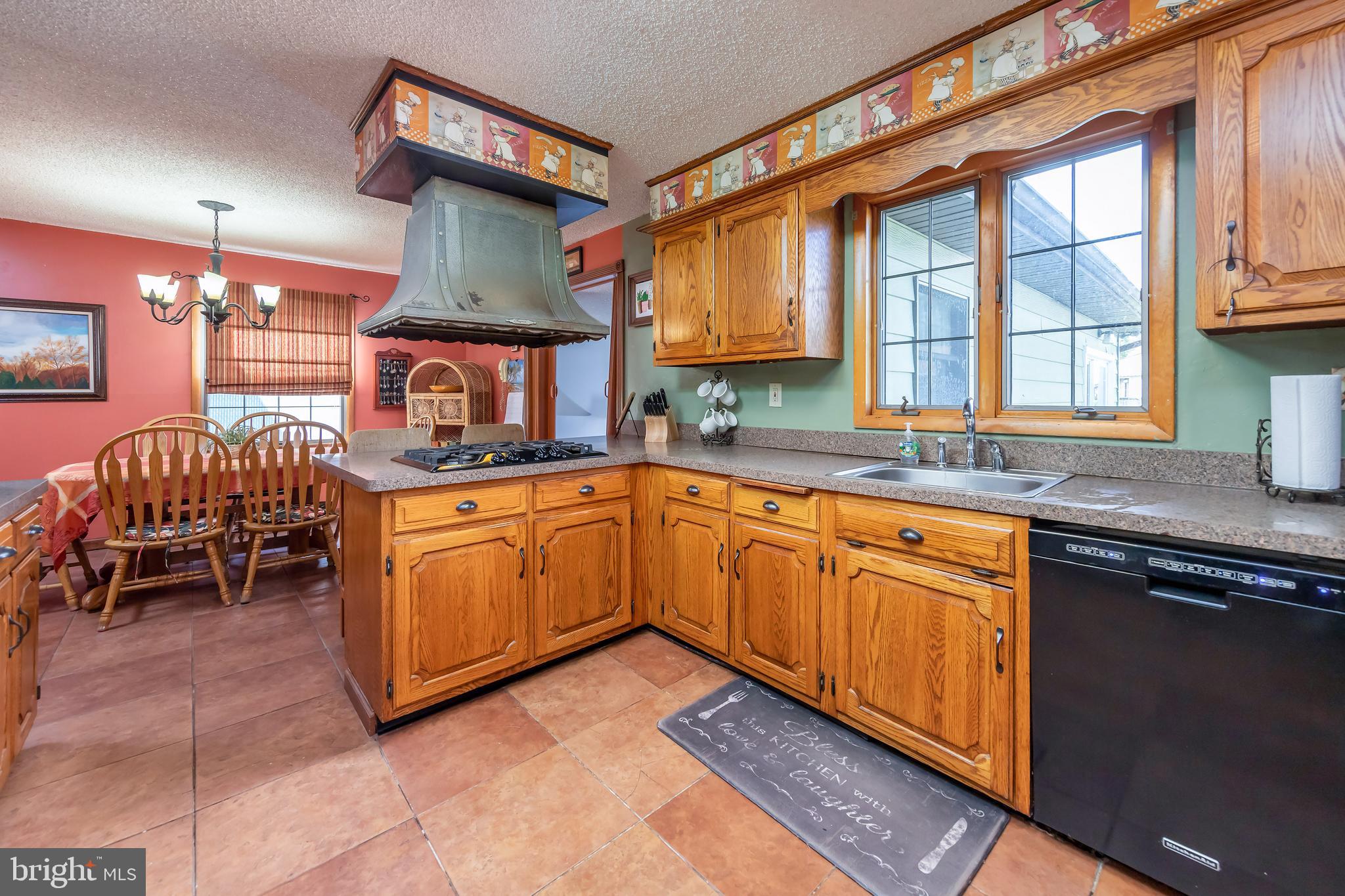 23 Randolph Road West Deptford, NJ 08096 - Photo 5 of 18 a kitchen with stainless steel appliances granite countertop a stove a sink and a microwave