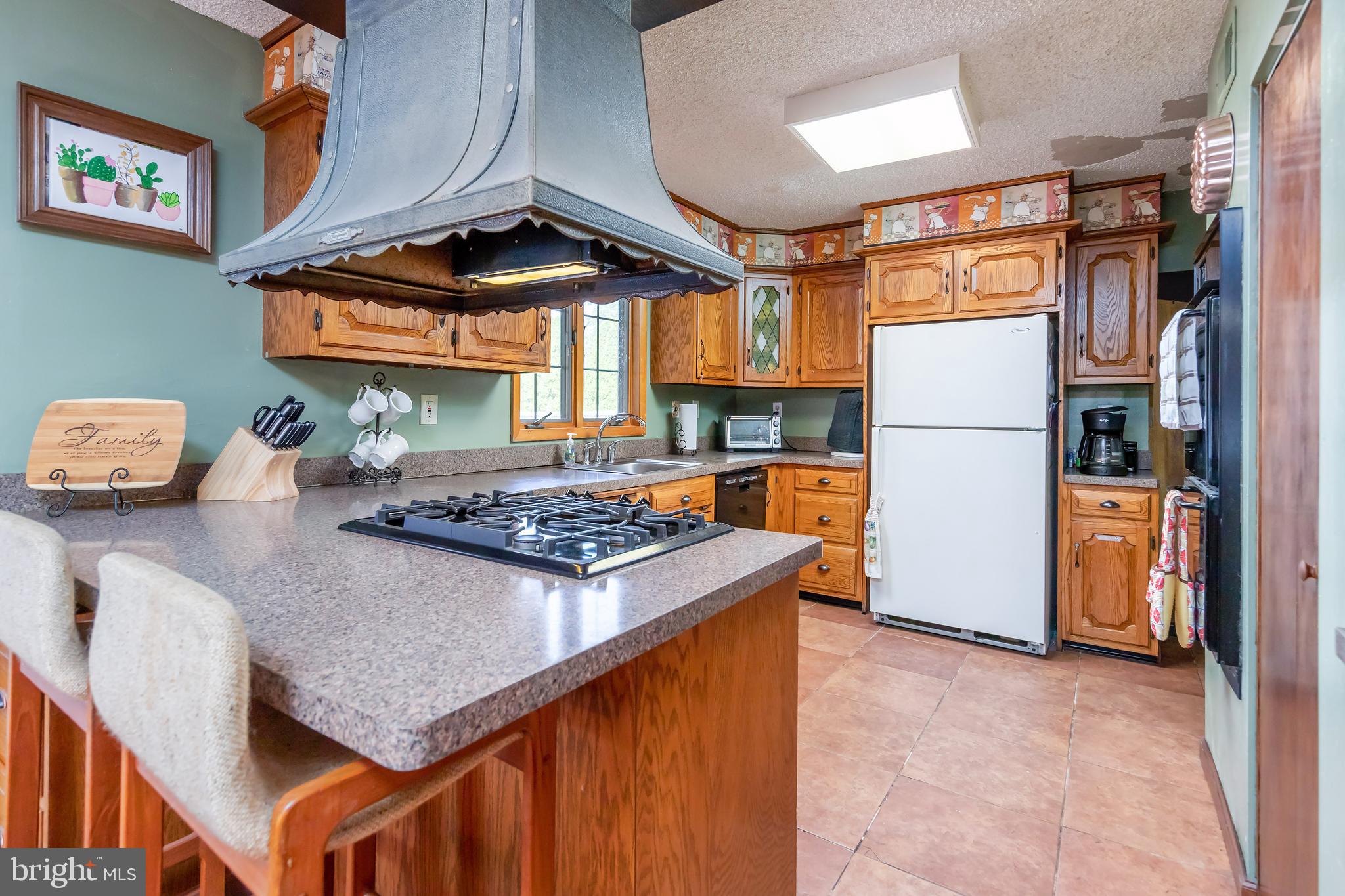 23 Randolph Road West Deptford, NJ 08096 - Photo 6 of 18 a kitchen with stainless steel appliances granite countertop a sink stove and refrigerator