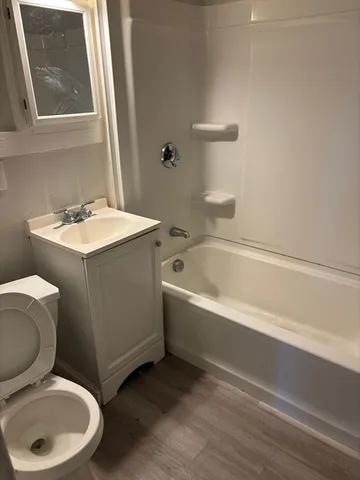 a bathroom with a sink toilet and bathtub
