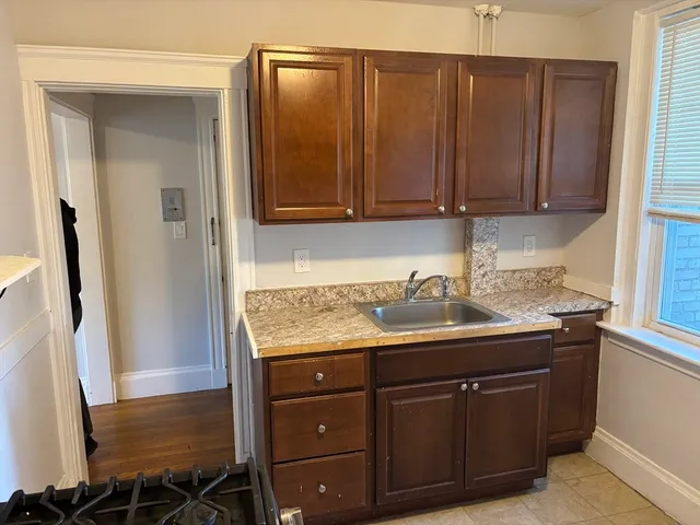 a kitchen with a sink and cabinets