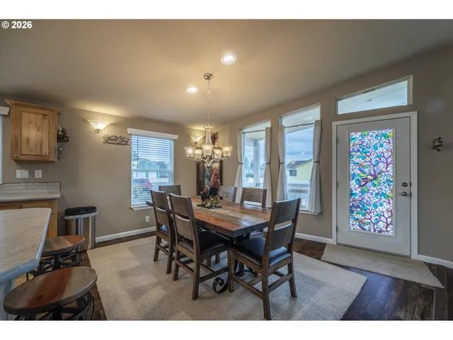 a view of a dining room with furniture and window
