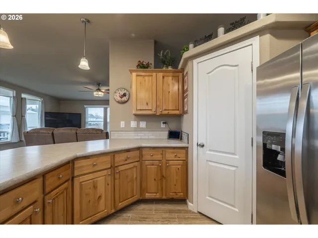 a kitchen with cabinets and white appliances