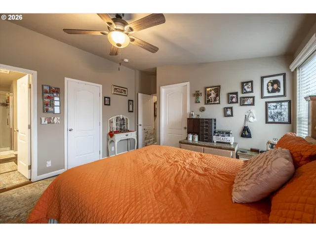 a bedroom with a bed and dresser