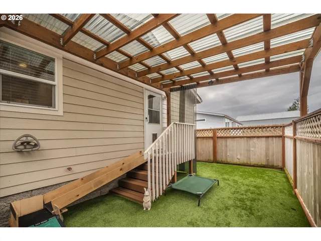 a view of backyard with a deck