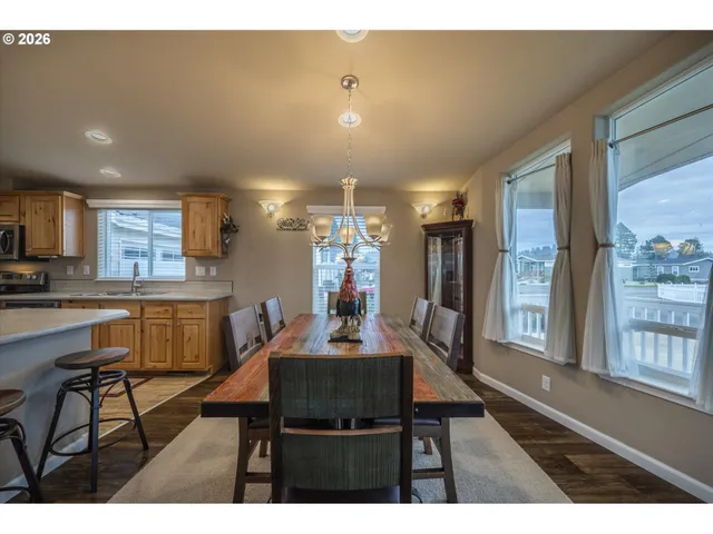 a dining room with furniture and a chandelier