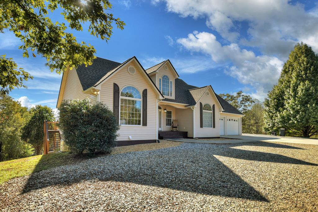3725 Ada Street Blue Ridge, GA 30513 - Photo 1 of 75 a front view of a house with a garden
