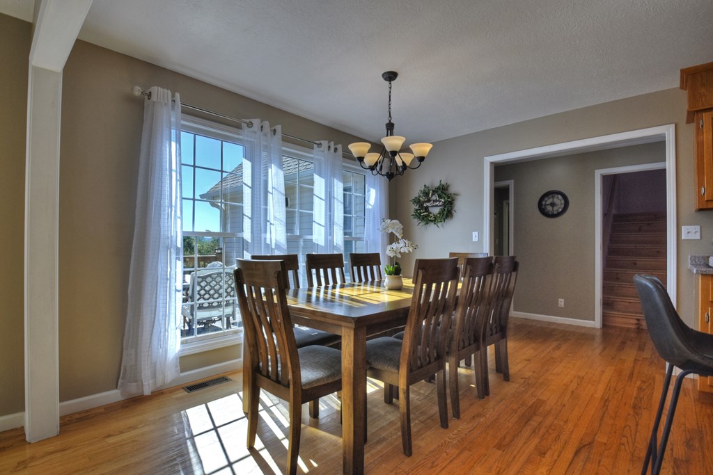 3725 Ada Street Blue Ridge, GA 30513 - Photo 11 of 75 a view of a dining room with furniture window and wooden floor