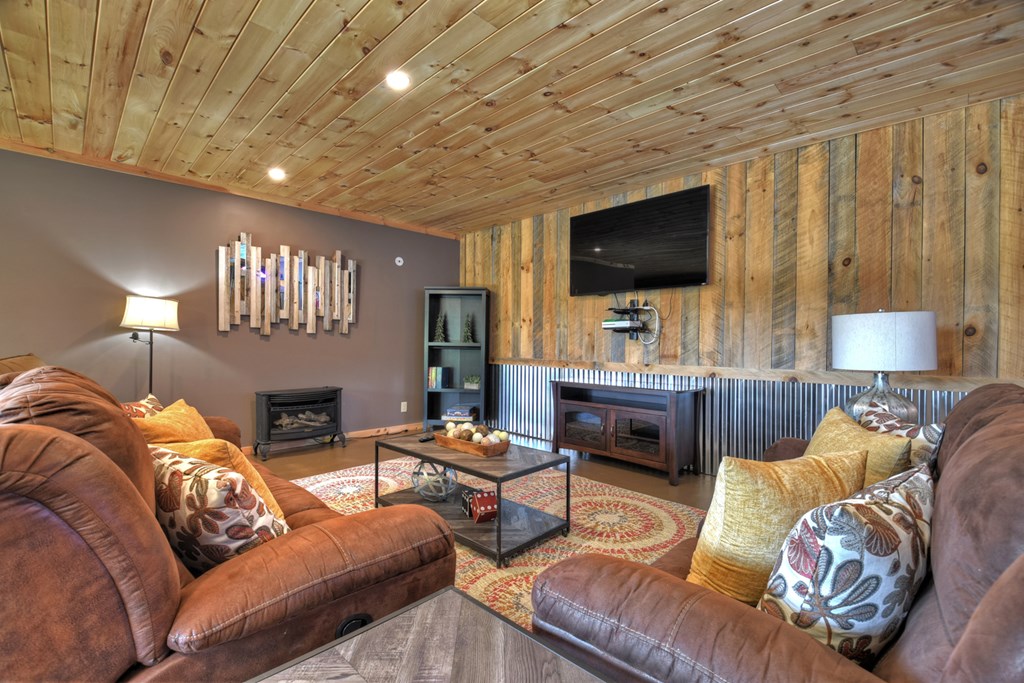 3725 Ada Street Blue Ridge, GA 30513 - Photo 27 of 75 a living room with furniture and a flat screen tv