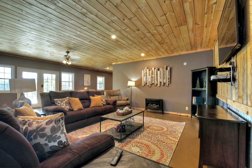 3725 Ada Street Blue Ridge, GA 30513 - Photo 28 of 75 a living room with furniture and a chandelier