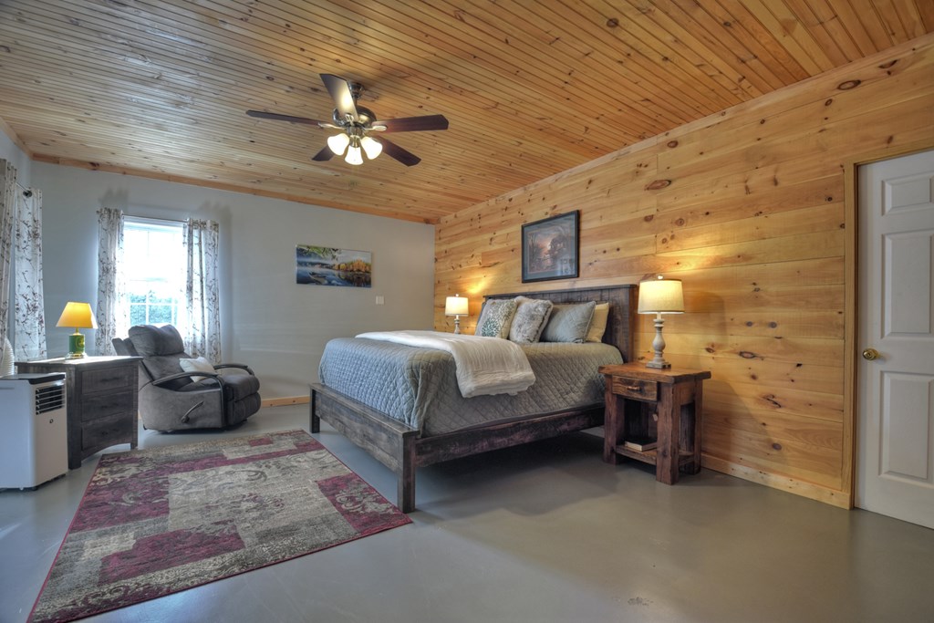 3725 Ada Street Blue Ridge, GA 30513 - Photo 34 of 75 a bedroom with a bed and ceiling fan