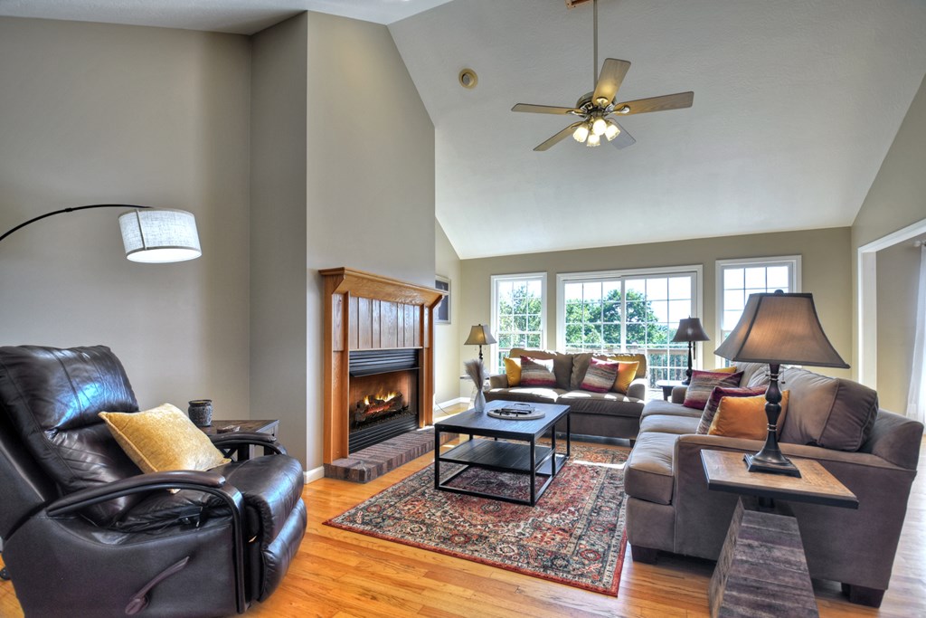 3725 Ada Street Blue Ridge, GA 30513 - Photo 5 of 75 a living room with furniture fireplace and a large window