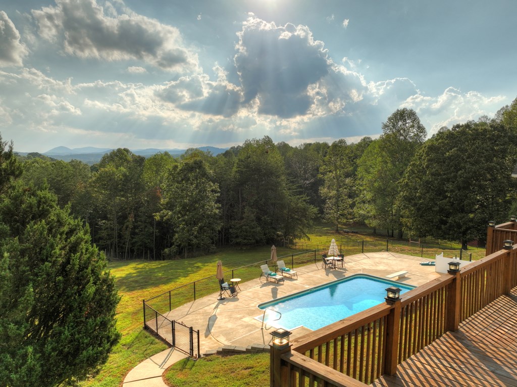 3725 Ada Street Blue Ridge, GA 30513 - Photo 60 of 75 a view of a swimming pool with a lounge chair