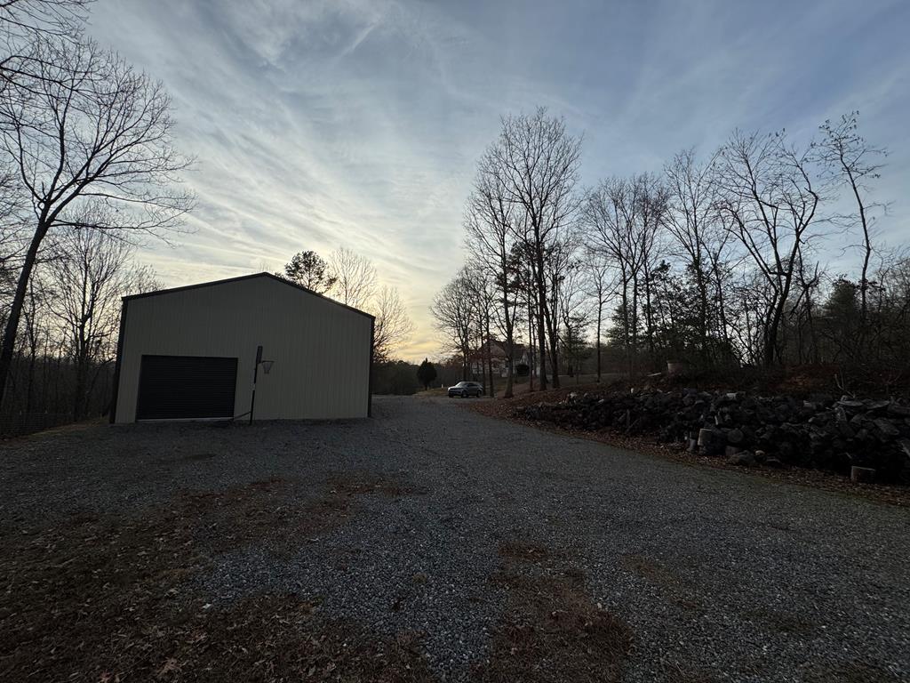 3725 Ada Street Blue Ridge, GA 30513 - Photo 71 of 75 a view of a house with a yard and trees