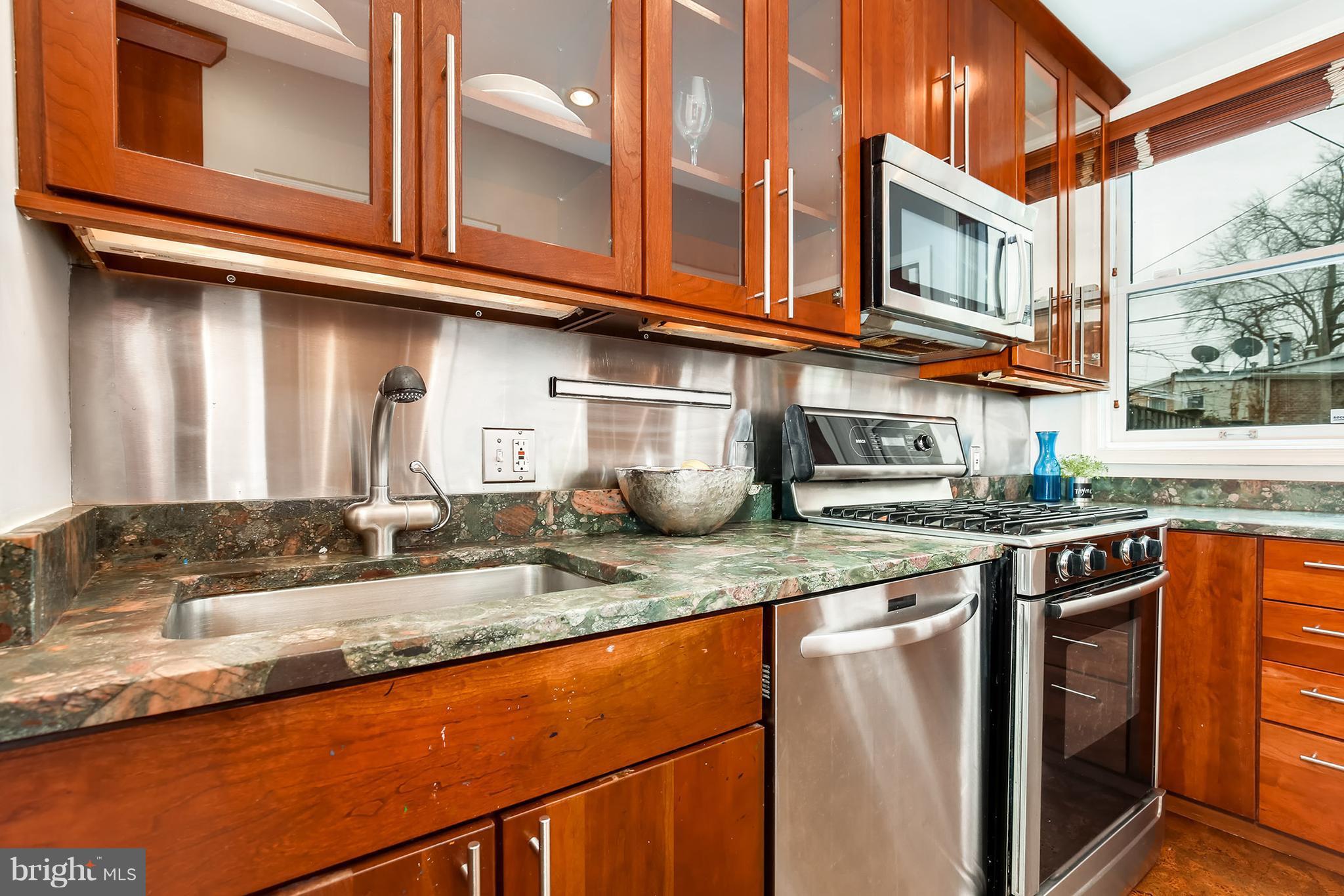 964 Florida Avenue Northwest Washington, DC 20001 - Photo 12 of 27 a kitchen with stainless steel appliances granite countertop a sink and a stove