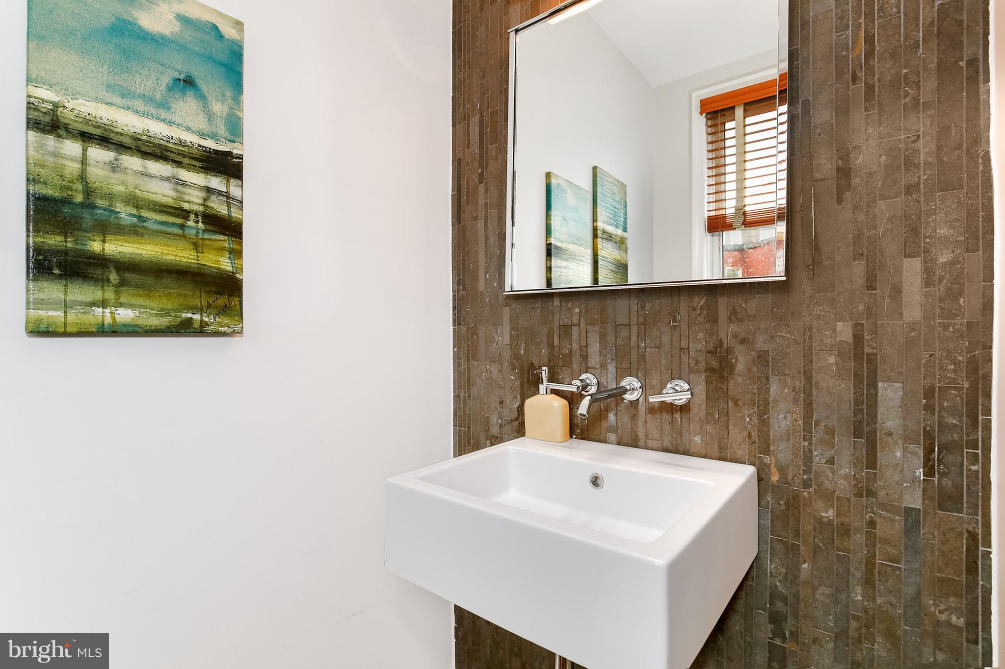 964 Florida Avenue Northwest Washington, DC 20001 - Photo 17 of 27 a bathroom with a sink and a mirror