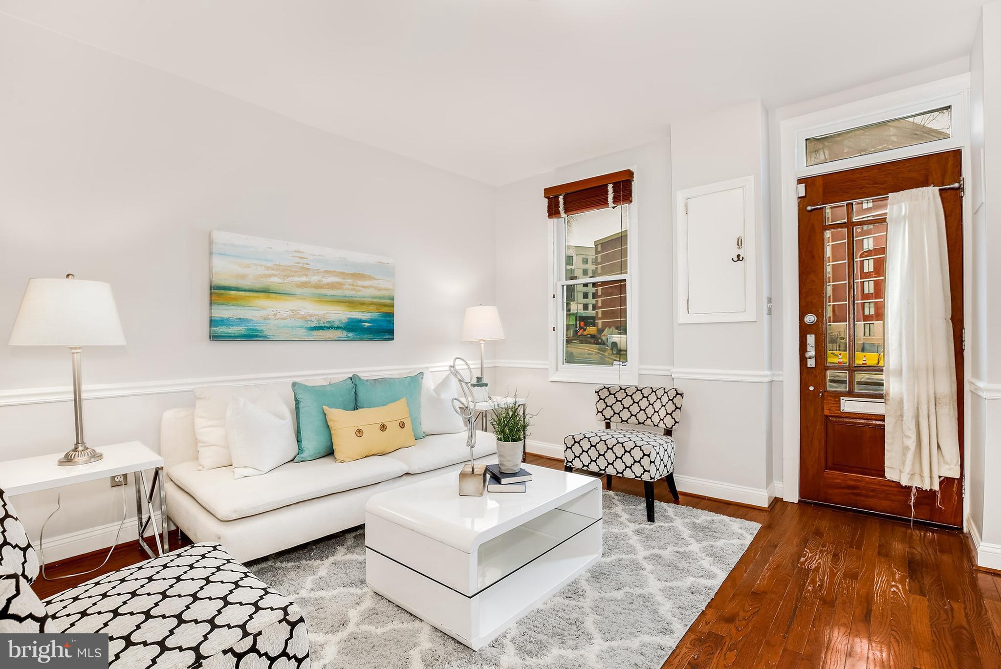 964 Florida Avenue Northwest Washington, DC 20001 - Photo 3 of 27 a living room with furniture and a window