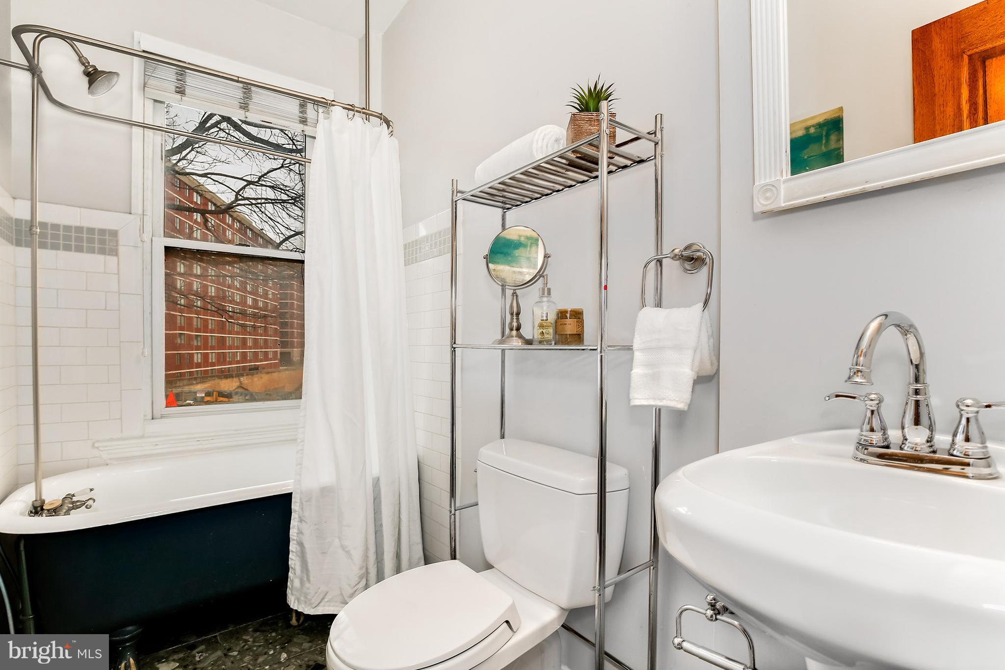 964 Florida Avenue Northwest Washington, DC 20001 - Photo 26 of 27 a bathroom with a sink a toilet and shower