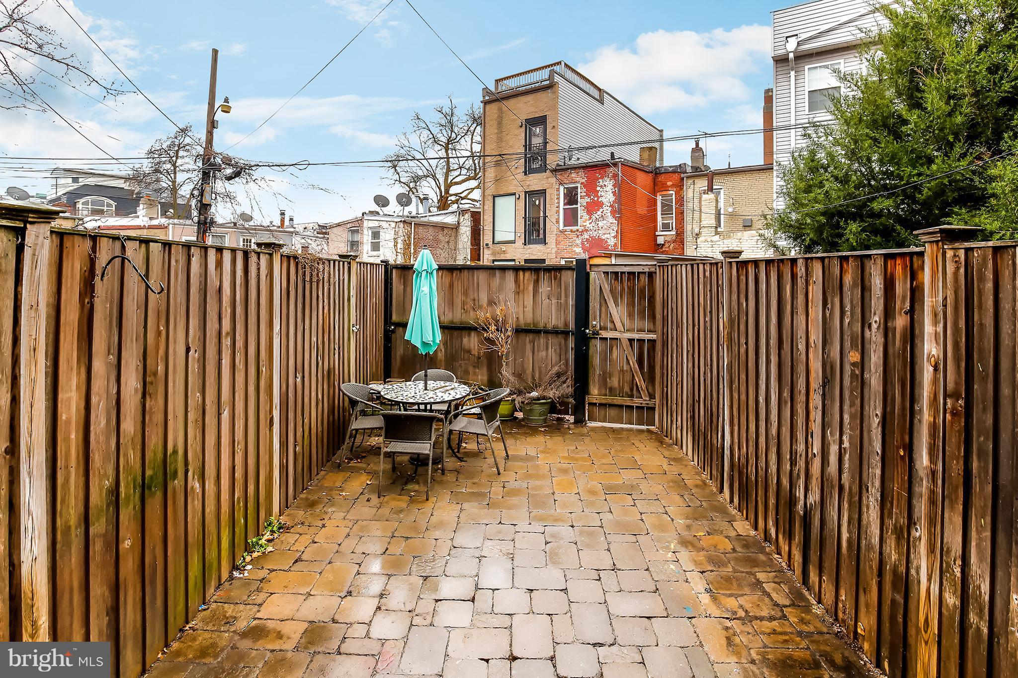 964 Florida Avenue Northwest Washington, DC 20001 - Photo 27 of 27 a view of a patio with a table and chairs
