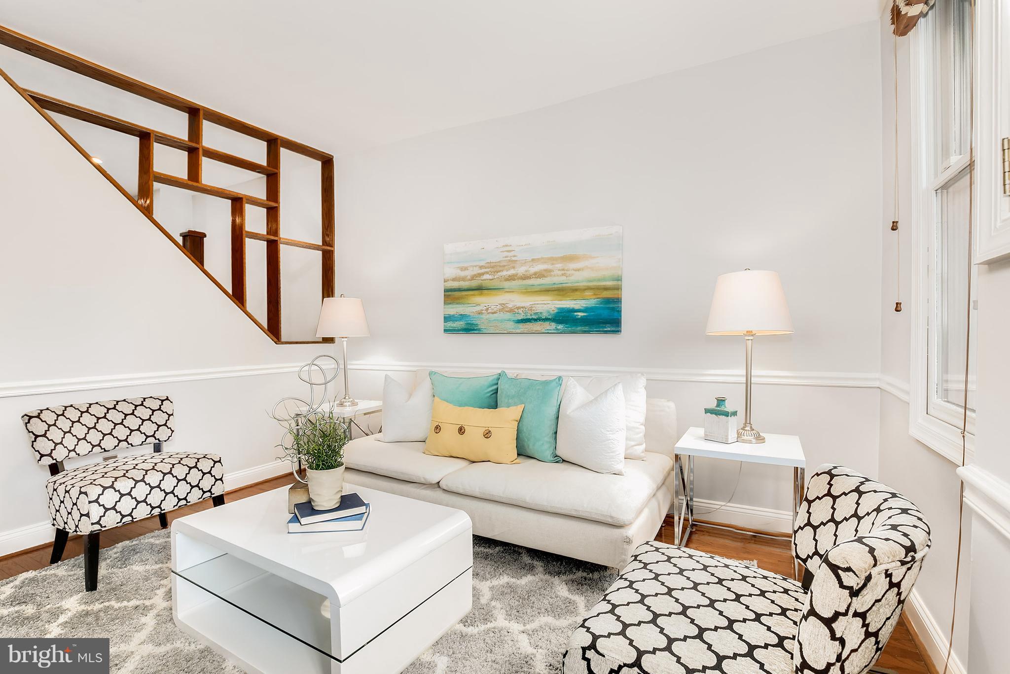 964 Florida Avenue Northwest Washington, DC 20001 - Photo 5 of 27 a living room with furniture and a painting on the wall