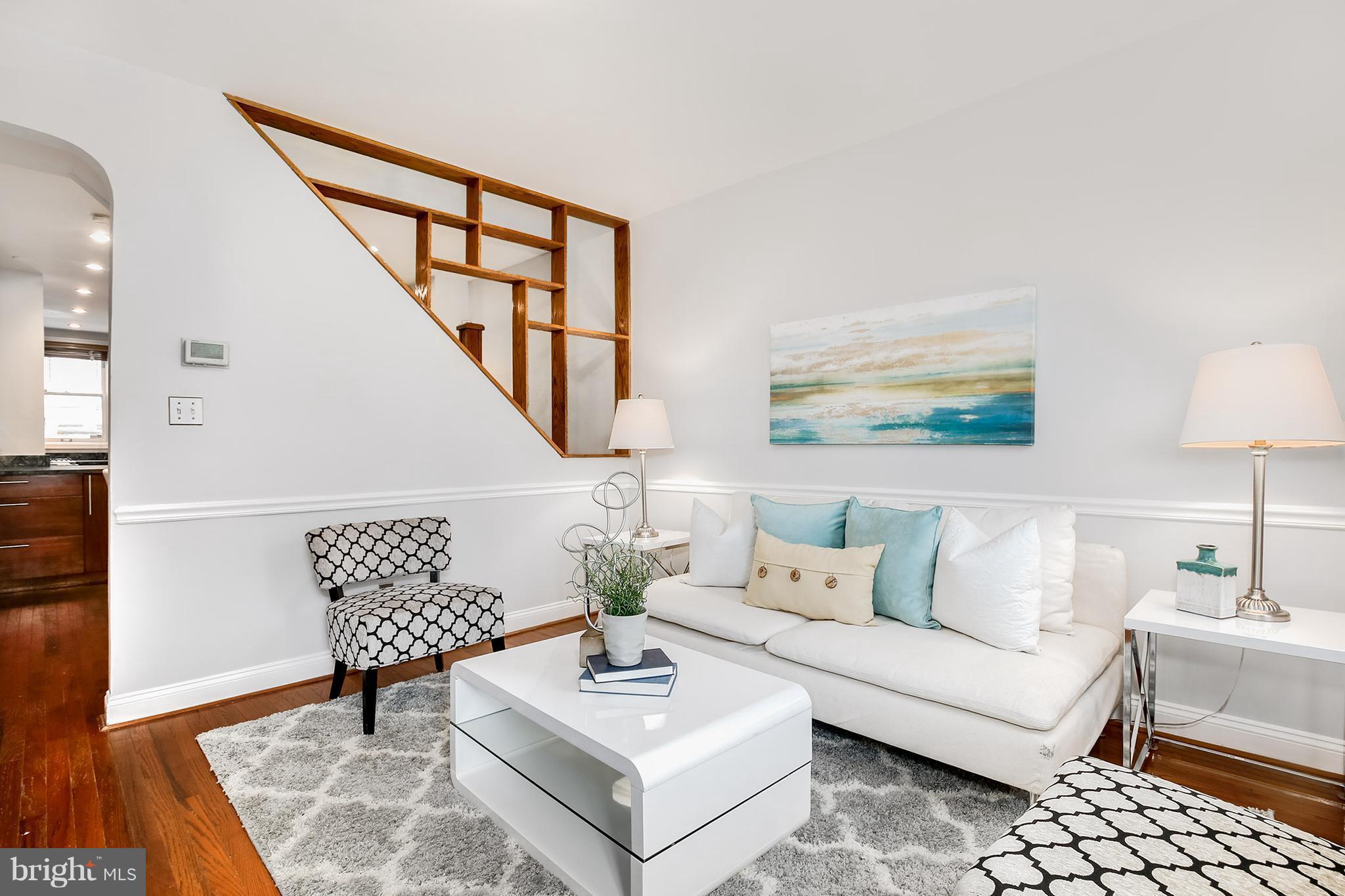 964 Florida Avenue Northwest Washington, DC 20001 - Photo 6 of 27 a living room with furniture and wooden floor