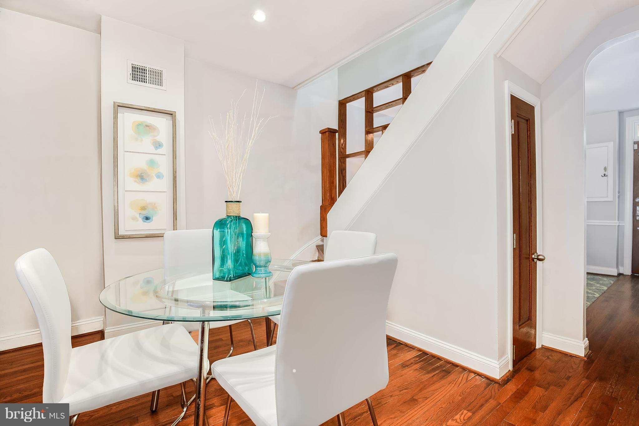 964 Florida Avenue Northwest Washington, DC 20001 - Photo 8 of 27 a view of a dining room with furniture window and wooden floor