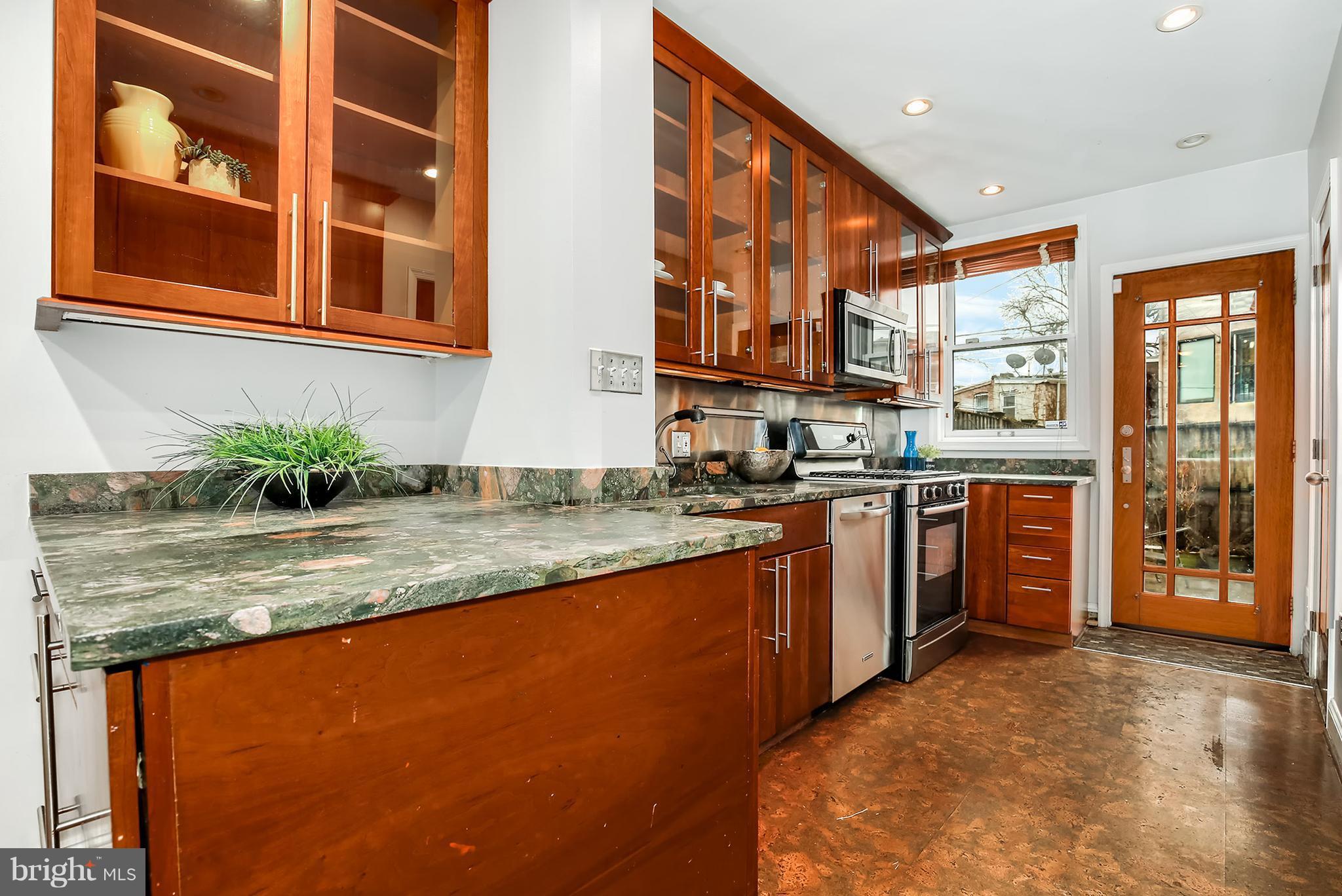 964 Florida Avenue Northwest Washington, DC 20001 - Photo 10 of 27 a kitchen with stainless steel appliances granite countertop a stove a sink and a refrigerator
