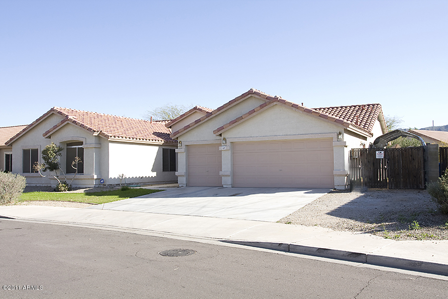 1609 East Greenway Road Phoenix, AZ 85042 - Photo 3 of 24 Side View Lookig at RV Gate