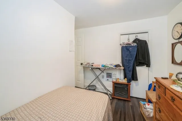 a bedroom with a workspace