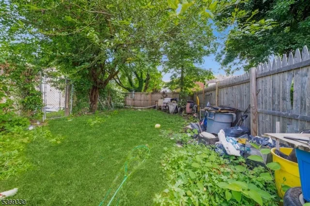 a front view of a house with outdoor seating