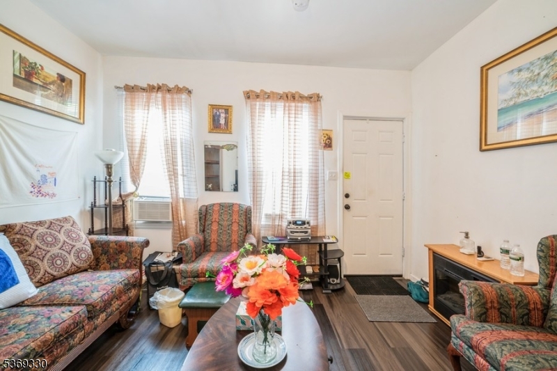 31 Bellevue Avenue Trenton, NJ 08618 - Photo 2 of 21 a living room with furniture and a couch