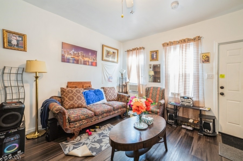 31 Bellevue Avenue Trenton, NJ 08618 - Photo 3 of 21 a living room with furniture and wooden floor