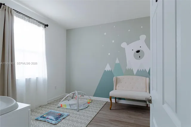 a view of a room with wooden floor and closet