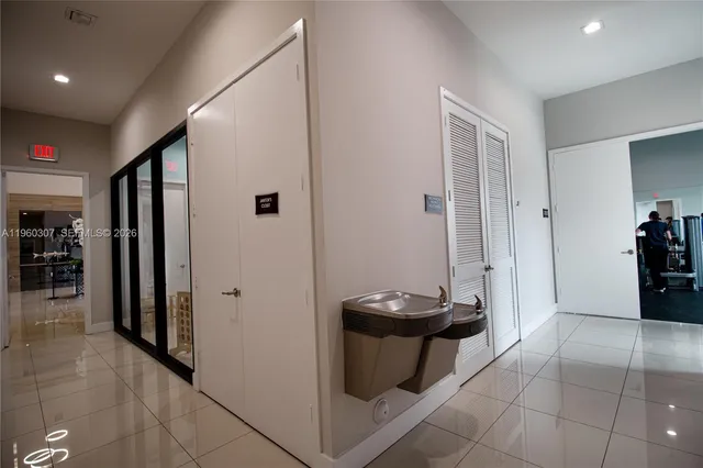 a view of lobby with furniture and wooden floor