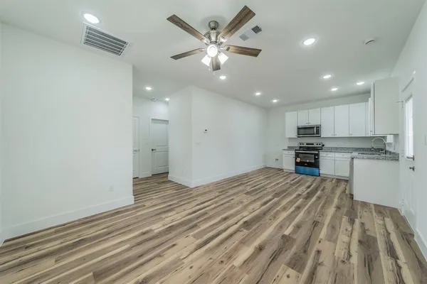 a view of kitchen with wooden floor and window