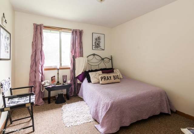 4160 Charleston Road Matteson, IL 60443 - Photo 12 of 15 a bedroom with a bed and a window