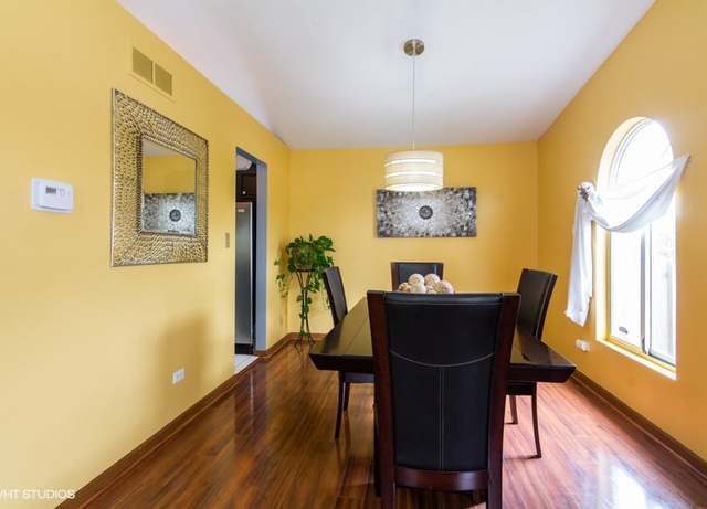 4160 Charleston Road Matteson, IL 60443 - Photo 4 of 15 a view of a dining room with furniture and wooden floor