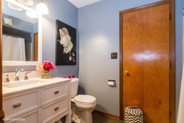 4160 Charleston Road Matteson, IL 60443 - Photo 10 of 15 a bathroom with a sink mirror vanity and toilet
