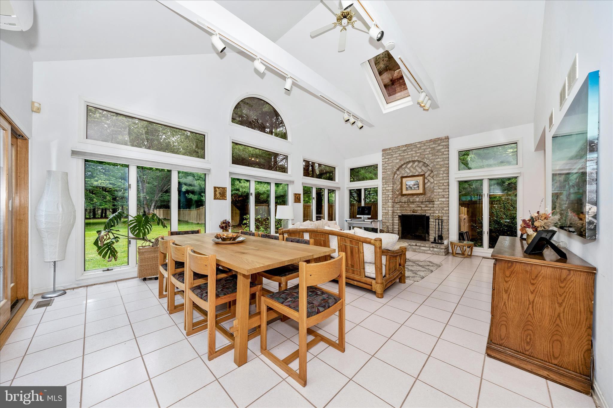 15749 Spade Road Hagerstown, MD 21740 - Photo 12 of 23 a view of a dining room with furniture large windows and wooden floor