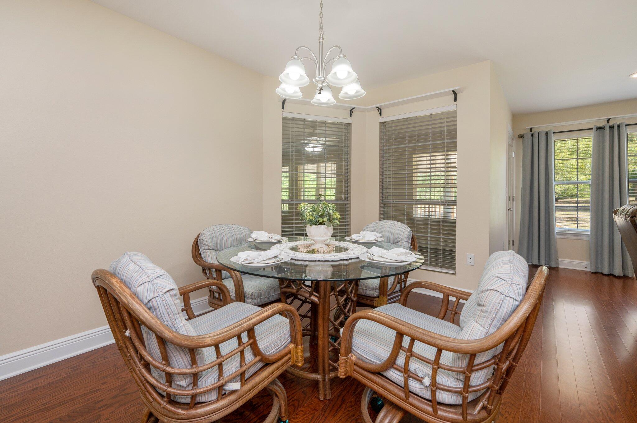 5777 Buckward Road Baker, FL 32531 - Photo 16 of 60 a view of a dining room with furniture and wooden floor
