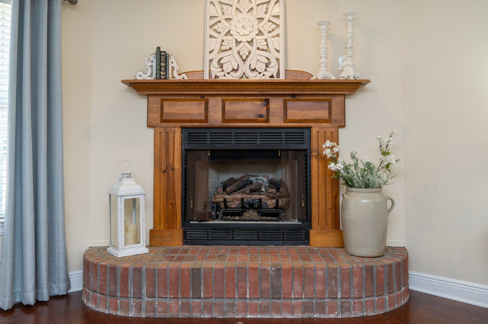 5777 Buckward Road Baker, FL 32531 - Photo 18 of 60 a living room with furniture and a fireplace