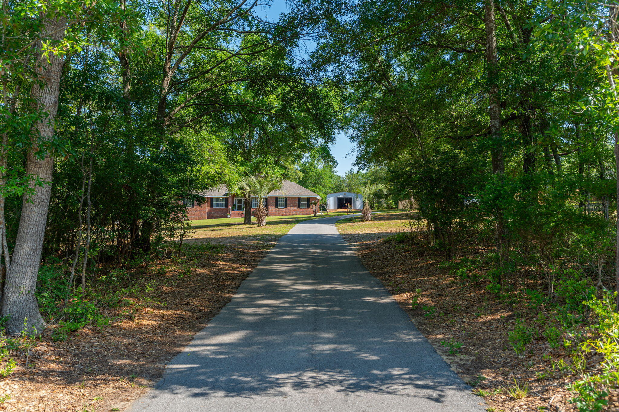 5777 Buckward Road Baker, FL 32531 - Photo 2 of 60 a front view of a house with a yard